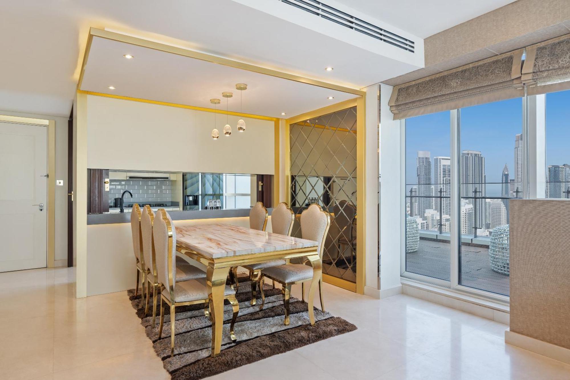 Damac Maison Distinction Dubái Exterior foto A dining room in a luxury apartment
