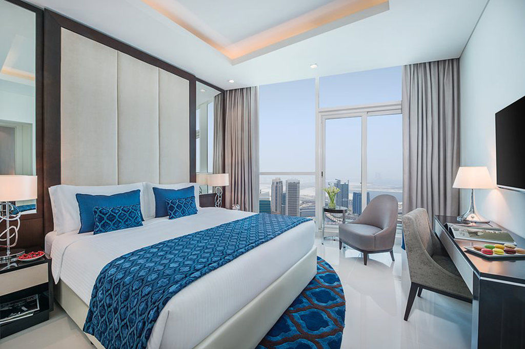 Damac Maison Distinction Dubái Exterior foto A bedroom at the hotel